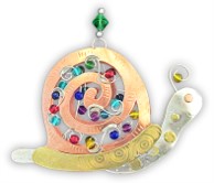 Decorative snail ornament with colorful beads on a white background made of recycled copper and brass