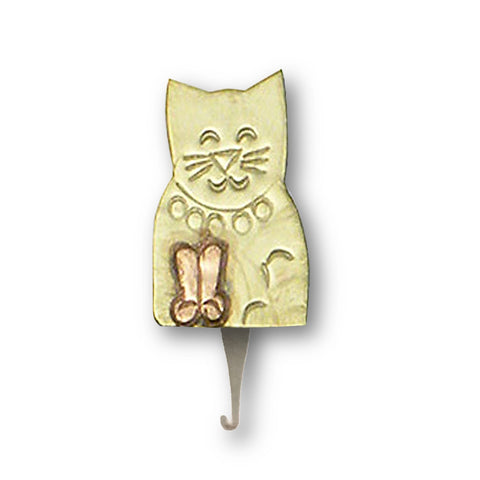 A gold-colored needle threader in the shape of a cat with a magnet in brass and copper recycled ecofriendly metals